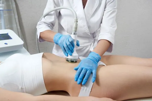 Lost the Weight but Not the Loose Skin? 2 woman having HIFU treatment on her stomach to combat loose skin City of London following weight loss